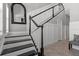 Stylish staircase with black and white design and tile flooring at 340 Sapphire Lake Dr # 202, Bradenton, FL 34209