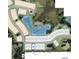 Aerial view of a planned community featuring home sites, ponds, a dog park, walking trails, and green spaces at 3411 Lumber Falls Dr, Plant City, FL 33565