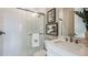 Modern bathroom with a glass-enclosed shower, stylish white subway tile, and a vanity with a marble countertop at 3411 Lumber Falls Dr, Plant City, FL 33565