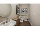 Well-lit bathroom with a modern sink, stylish mirror, and accessible features at 3411 Lumber Falls Dr, Plant City, FL 33565