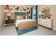 Bright and playful bedroom featuring butterfly decor, a comfortable bed, and stylish furniture at 3411 Lumber Falls Dr, Plant City, FL 33565