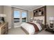 Serene bedroom featuring a queen bed, scenic views from two windows, and stylish furnishings for a relaxing atmosphere at 3411 Lumber Falls Dr, Plant City, FL 33565