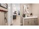 Inviting hallway with stylish decor, coffee bar, and an open view into other living spaces at 3411 Lumber Falls Dr, Plant City, FL 33565
