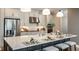 Modern kitchen featuring a large island, stainless steel appliances, and stylish pendant lighting at 3411 Lumber Falls Dr, Plant City, FL 33565