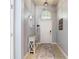 Inviting entrance hallway featuring a decorative table and overhead lighting at 3512 Gerrads Cross Ct, Land O Lakes, FL 34638