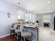 Kitchen featuring granite countertops and a breakfast bar with seating at 3512 Gerrads Cross Ct, Land O Lakes, FL 34638