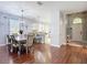 An open-concept living space with a dining area and views into the kitchen at 3512 Gerrads Cross Ct, Land O Lakes, FL 34638