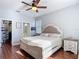 Bright main bedroom with hardwood floors, large windows, and closet at 3512 Gerrads Cross Ct, Land O Lakes, FL 34638