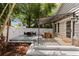 Inviting back deck with dining and seating area, perfect for relaxing and entertaining near the lush backyard at 3620 W San Pedro St, Tampa, FL 33629