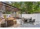 Backyard deck featuring outdoor dining, seating, and a covered patio area perfect for entertaining at 3620 W San Pedro St, Tampa, FL 33629