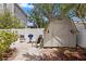 Outdoor space with a shed, cozy chairs, and a grill for entertaining at 3620 W San Pedro St, Tampa, FL 33629