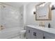 Bright bathroom with tiled shower, marble vanity, and updated fixtures at 3620 W San Pedro St, Tampa, FL 33629