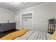 Relaxing bedroom with dark wood floors, light walls, and a gray dresser at 3620 W San Pedro St, Tampa, FL 33629