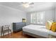 Comfortable bedroom with wood floors, dresser, white trim and two windows with views of the outdoors at 3620 W San Pedro St, Tampa, FL 33629