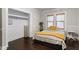 Bedroom features wood floors, bright windows, a closet and neutral decor and craftsman trim at 3620 W San Pedro St, Tampa, FL 33629