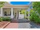 Covered carport with access to front porch and white gate at 3620 W San Pedro St, Tampa, FL 33629