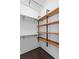 Well-organized closet with custom wooden shelving, offering plenty of storage for clothes and accessories at 3620 W San Pedro St, Tampa, FL 33629