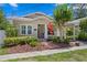Charming single-story home featuring a brick walkway, covered porch, and beautiful landscaping at 3620 W San Pedro St, Tampa, FL 33629