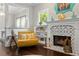 Comfortable seating arrangement with throw pillows next to fireplace at 3620 W San Pedro St, Tampa, FL 33629
