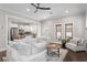 Bright living room showcasing an open floor plan with hardwood floors and modern furnishings at 3620 W San Pedro St, Tampa, FL 33629