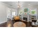 Stylish living room with a decorative fireplace, built-in bookshelves, and an adjacent dining area at 3620 W San Pedro St, Tampa, FL 33629