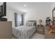Comfortable bedroom featuring a queen bed, TV, and a bright window at 36628 Spanish Rose Dr, Dade City, FL 33525