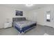 Tastefully decorated bedroom featuring neutral tones, ample natural light, and a chandelier at 36628 Spanish Rose Dr, Dade City, FL 33525