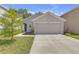 Charming one-story home with a neutral paint scheme and a two-car garage at 36628 Spanish Rose Dr, Dade City, FL 33525