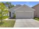 Charming one-story home with a neutral paint scheme and a two-car garage at 36628 Spanish Rose Dr, Dade City, FL 33525