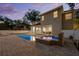 The backyard features a sparkling in-ground pool and spa plus a covered patio for entertaining at 4515 W Leona St, Tampa, FL 33629