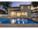 The backyard features a sparkling in-ground pool with lighting plus a covered patio for outdoor enjoyment at 4515 W Leona St, Tampa, FL 33629