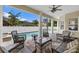 Inviting outdoor space with a covered patio, comfortable seating, and a sparkling pool at 4515 W Leona St, Tampa, FL 33629