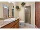 Bathroom featuring a sink with granite countertops and a tiled walk-in shower at 4515 W Leona St, Tampa, FL 33629