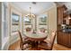 Cozy breakfast nook with large windows providing a view of the pool and backyard at 4515 W Leona St, Tampa, FL 33629