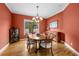 Formal dining room with hardwood floors, a chandelier, and elegant furnishings at 4515 W Leona St, Tampa, FL 33629