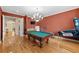 Spacious game room has a billiard table, mini fridge, and arcade game at 4515 W Leona St, Tampa, FL 33629