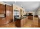 Large kitchen with an island, stainless steel refrigerator, and an abundance of cabinet space at 4515 W Leona St, Tampa, FL 33629