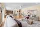 Open-concept living room with a view of the kitchen, features modern decor and natural light at 4515 W Leona St, Tampa, FL 33629