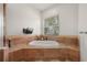 The main bathroom features a bathtub, tile floors, and large window at 4515 W Leona St, Tampa, FL 33629