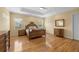 Well-lit main bedroom boasts hardwood floors and traditional decor at 4515 W Leona St, Tampa, FL 33629