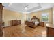 Spacious main bedroom features tray ceilings, hardwood floors, and lots of natural light at 4515 W Leona St, Tampa, FL 33629