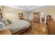 This spacious main bedroom has an ensuite bathroom and an armoire at 4515 W Leona St, Tampa, FL 33629