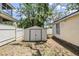 Backyard featuring storage shed and partial fencing at 526 5Th N Ave, Safety Harbor, FL 34695
