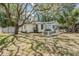 Quaint home featuring large yard, fencing, and outdoor storage at 526 5Th N Ave, Safety Harbor, FL 34695