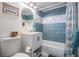 Bathroom featuring blue and white tiling, a modern sink, and a shower-tub combination at 526 5Th N Ave, Safety Harbor, FL 34695