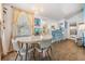 Bright dining area adjacent to the kitchen with a table, chairs, and cheerful decor at 526 5Th N Ave, Safety Harbor, FL 34695