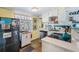 Compact kitchen featuring modern appliances, bright yellow walls, and ample natural light at 526 5Th N Ave, Safety Harbor, FL 34695