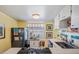 Charming yellow kitchen featuring modern appliances and a bright window for natural light at 526 5Th N Ave, Safety Harbor, FL 34695