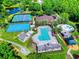 Aerial view of community amenities, including tennis courts, basketball court, pool, and splash pad at 6030 Sandhill Ridge Dr, Lithia, FL 33547