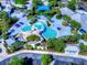 Aerial view showcasing the community pool with a rock waterfall feature and ample lounging space at 6030 Sandhill Ridge Dr, Lithia, FL 33547